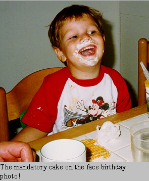 The mandatory cake on the face birthday photo...